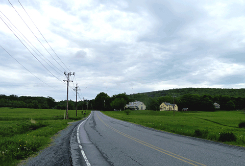 Power lines along the roadway keep communities connected.