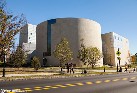 Pedestrians outside the Lewis Center for the Arts at Princeton.