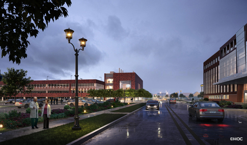 Rendering of road with cars driving to and from a brick emergency services building.