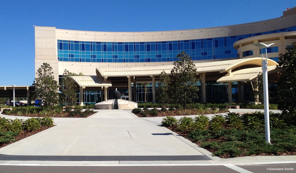 Entrance, gardens, and pathways of St. Joseph’s Hospital-South building.