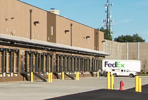 Birds fly over the truck bays at the FedEx Distribution Center in Natick, Massachusetts.