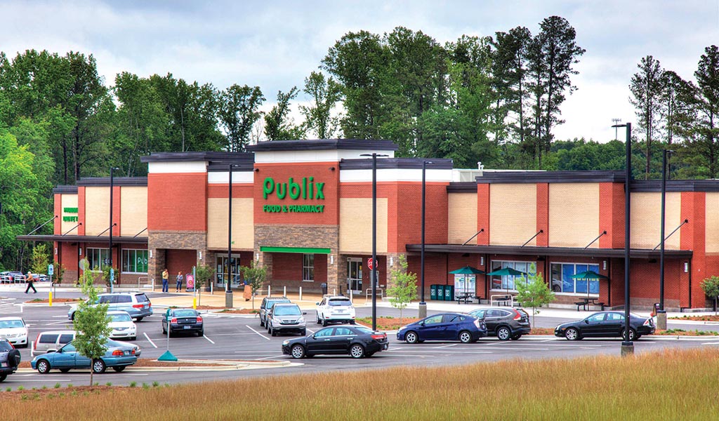 Publix grocery store storefront and parking lot in Apex, North Carolina.