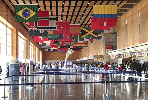 Passengers check in for their flights at Boston-Logan International Airport.