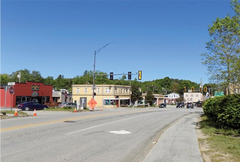 Route 202 intersection with stoplights and buildings prior to improvements.