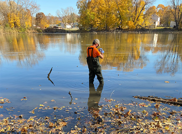 Scientist conducting surface water sampling.