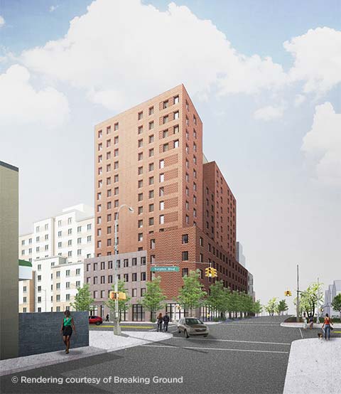 Tall, red-brick building on a street corner in Jamaica, Queens, New York.