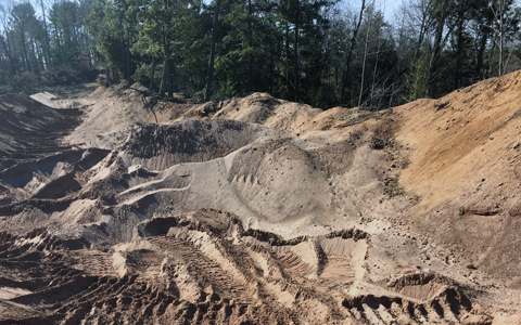 Gravel pits with a trees in the background