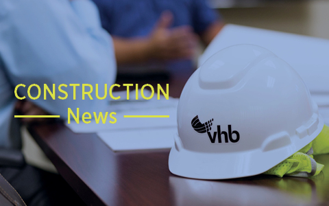 White construction hat sitting on a conference table