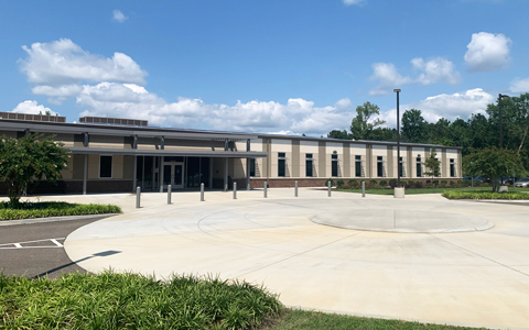 Front facade of East Center Mental Health building and front entrance roundabout.