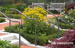 Graphic depicting green space outside a hospital where people walk and recreate.