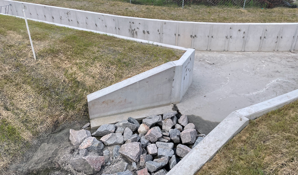 Completed concrete stream channel as part of the new Burton Station infrastructure to mitigate flooding.