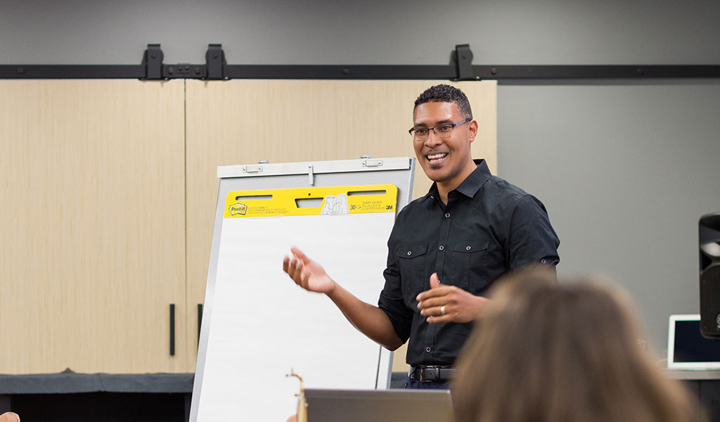 VHB employee presents to employees in a classroom.