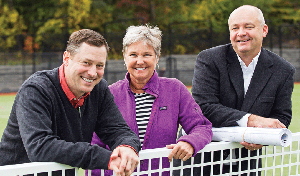 Members of VHB’s institutional team visit a sports field.