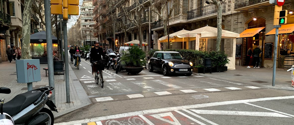  A downtown street in Barcelona with lanes clearly marked for pedestrians and bicyclists.