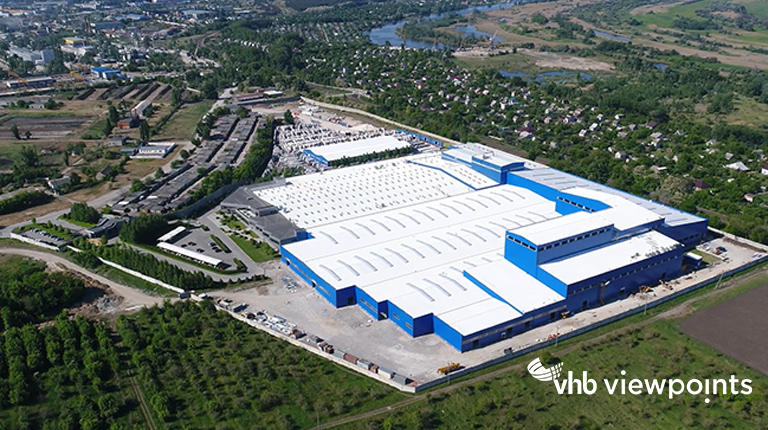 Aerial view of an industrial and manufacturing facility in an urban area