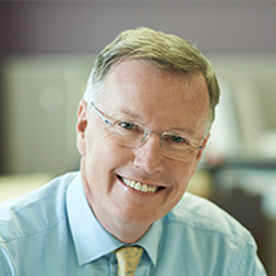 David McIntyre in a baby blue shirt and yellow tie